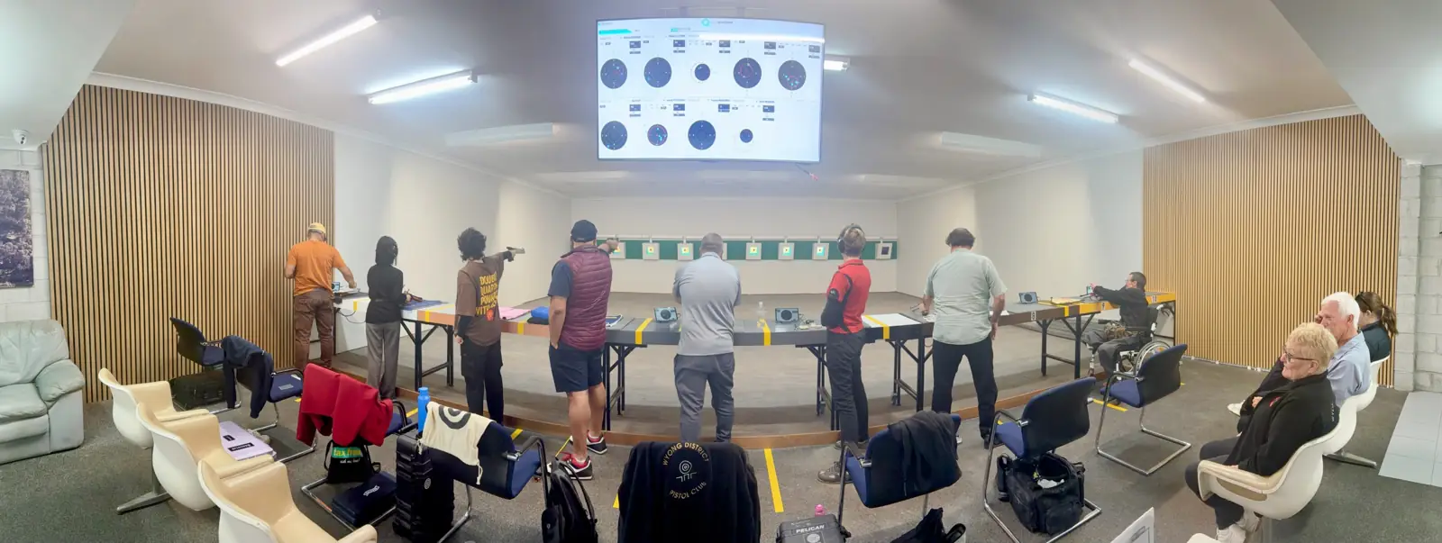 A full line of shooters on the indoor air pistol range