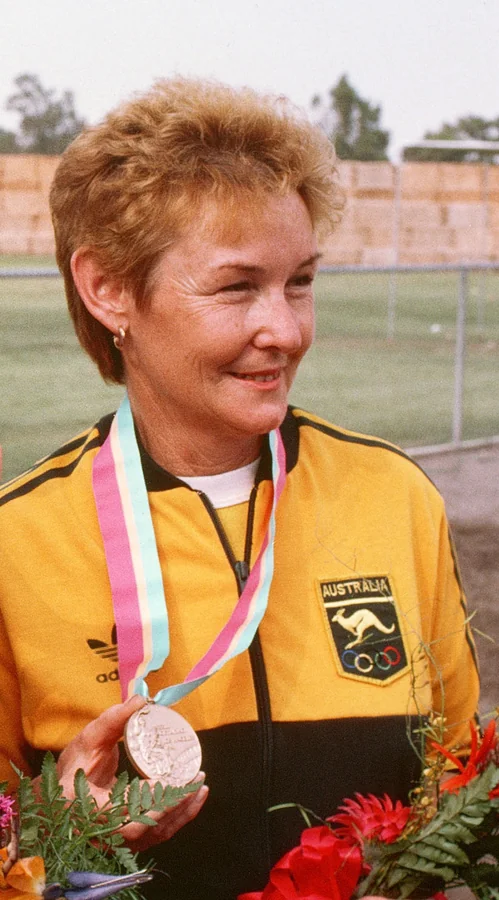 Pattie Dench in Australian team colours, holding her bronze medal at the 1984 Los Angeles Olympics